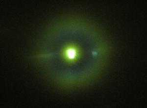 Corona around street lamps through an aspirated window pane.